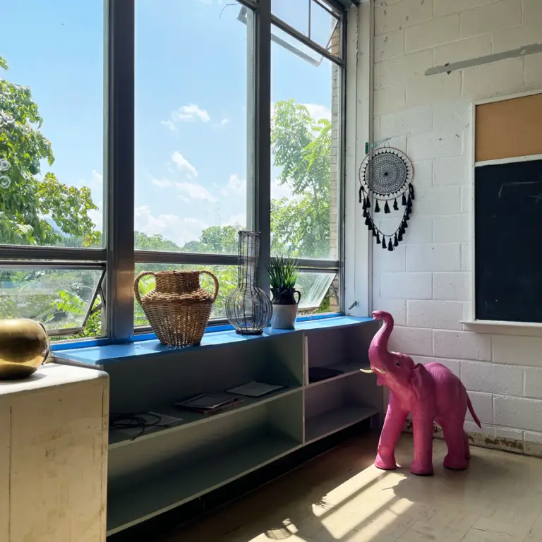 inside church street studios, looking out a window, decorated with miscellaneous treasure